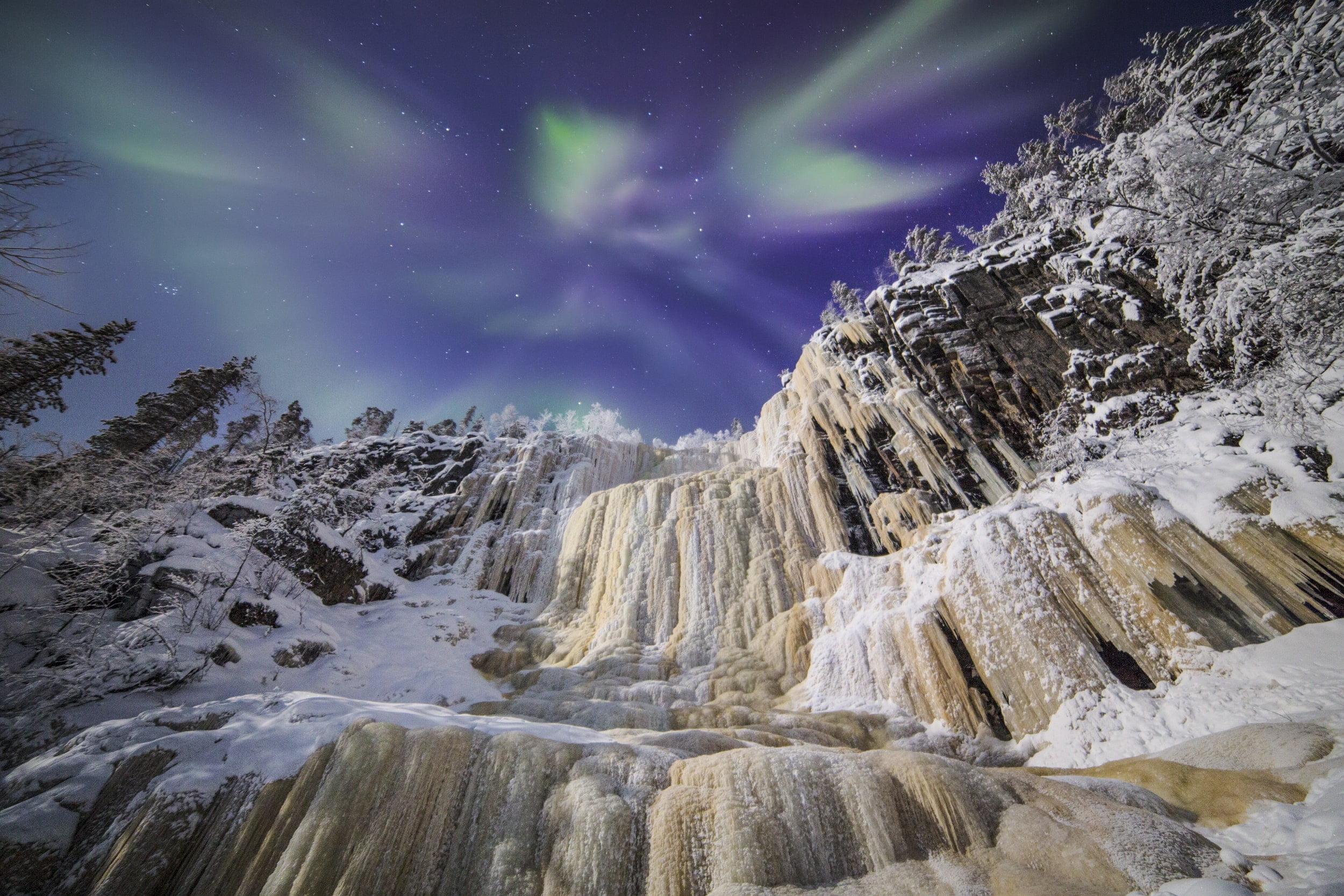 Korouoma icefalls under auroras